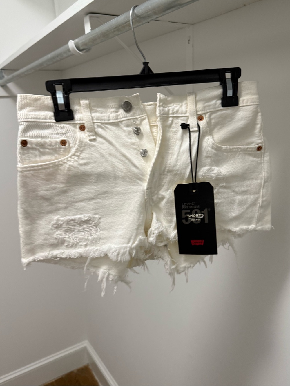 Levi’s: White Distressed Denim Shorts
